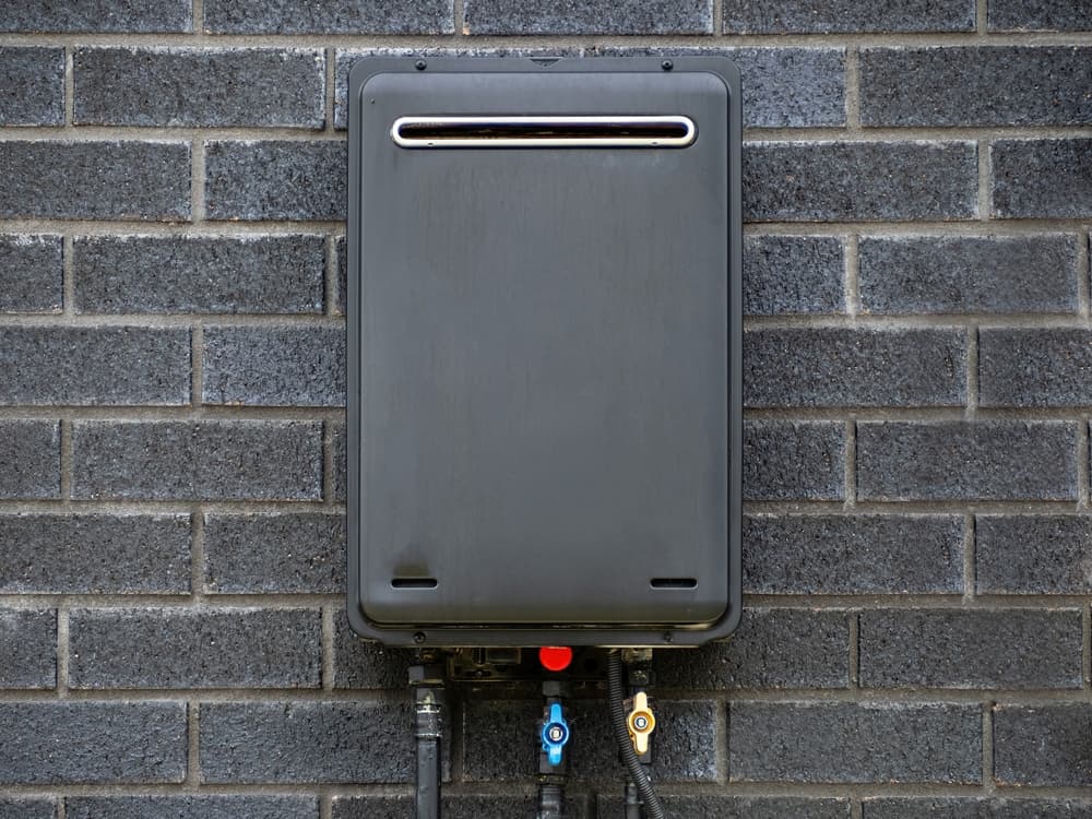black-tankless-water-heater-outside-of-home black-tankless-water-heater-outside-of-home